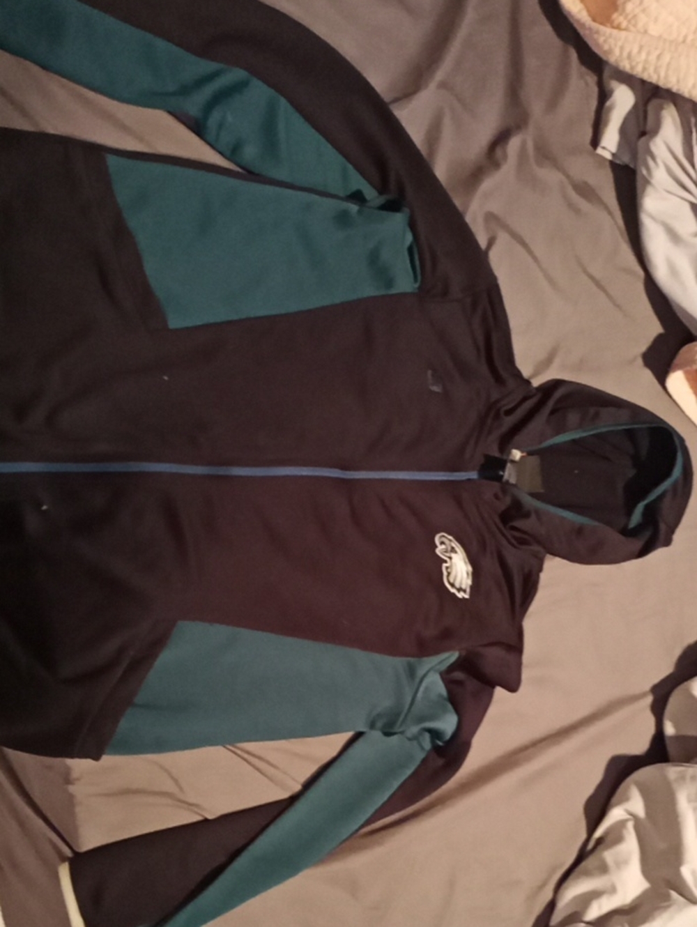 NFL Men's Black and Teal Zip-Up Hoodie with Team Logo